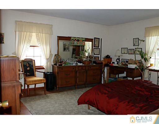 10 Bradford Road Edison, NJ 08820 - Photo 8 of 13 a living room with furniture window and a flat screen tv