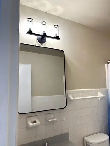 a bathroom with a sink and mirror