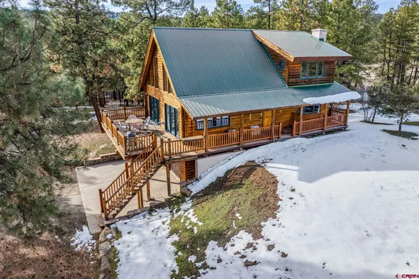 a aerial view of a house with a yard