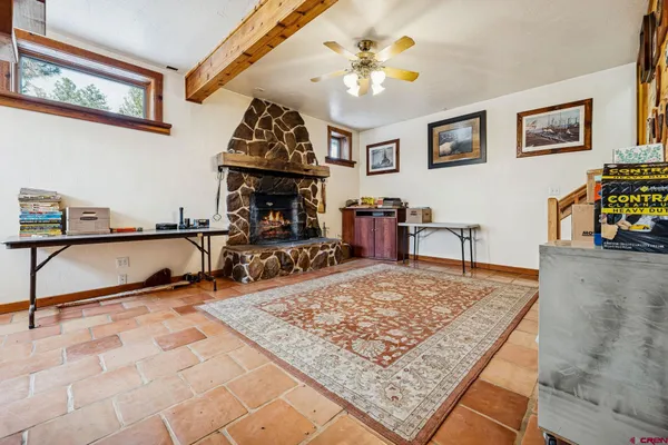 a living room with couch and a rug