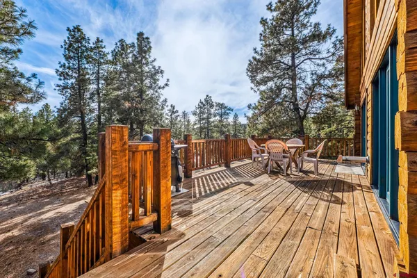 a view of a chairs on wooden deck