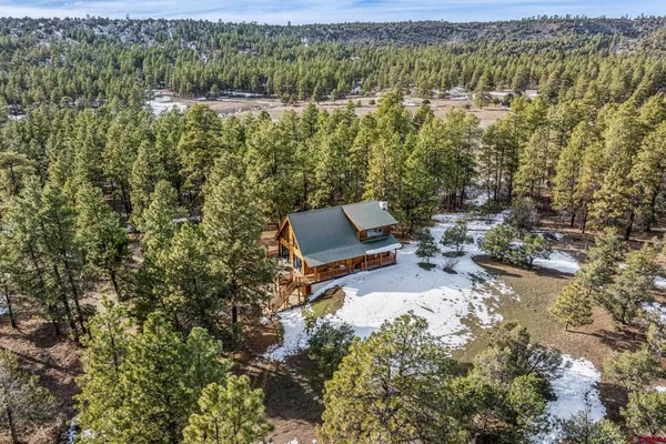 a aerial view of a house with a yard