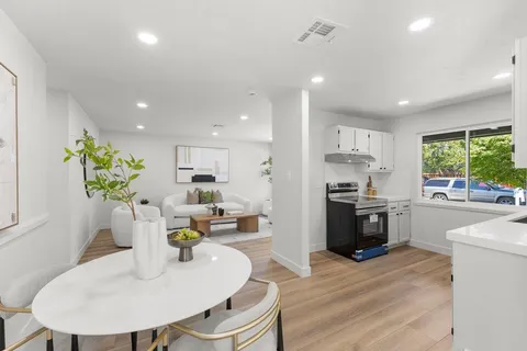a living room with furniture fireplace and window