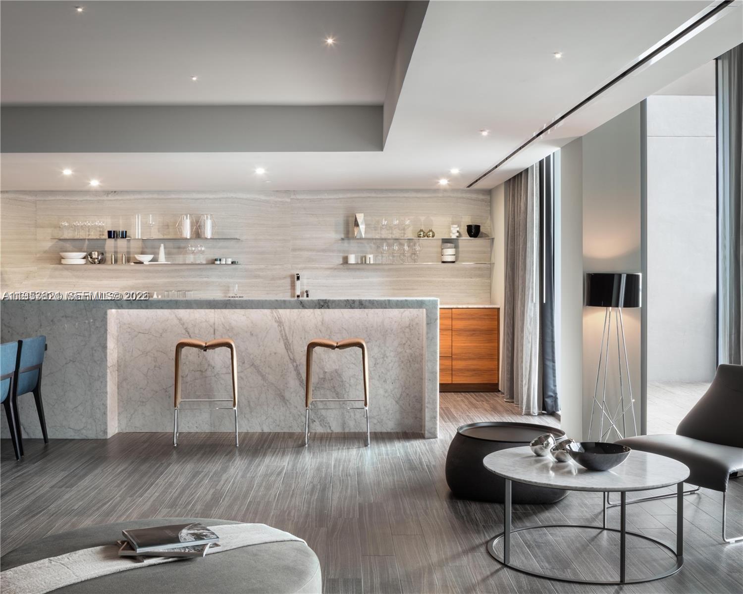 88 Southwest 7th Street, Unit 2506 Miami, FL 33130 - Photo 29 of 32 a kitchen with stainless steel appliances granite countertop a stove and a refrigerator