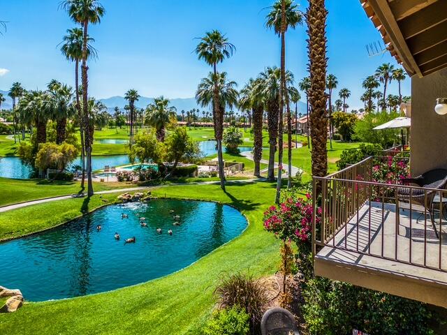 38101 Crocus Lane Palm Desert, CA 92211 - Photo 1 of 28 a view of a golf course with a lake view