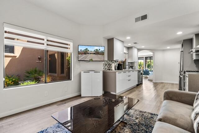 38101 Crocus Lane Palm Desert, CA 92211 - Photo 14 of 28 a living room with furniture and a large window
