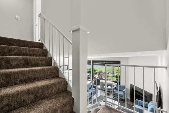 a view of a livingroom with furniture and floor to ceiling windows