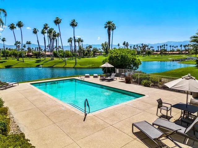 a view of a swimming pool and a chairs