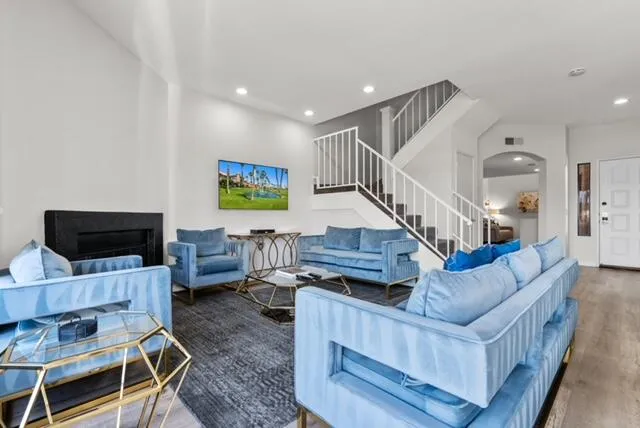 a living room with furniture and a flat screen tv