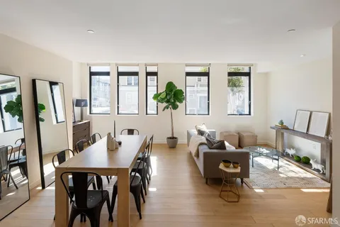 a living room with furniture and a table