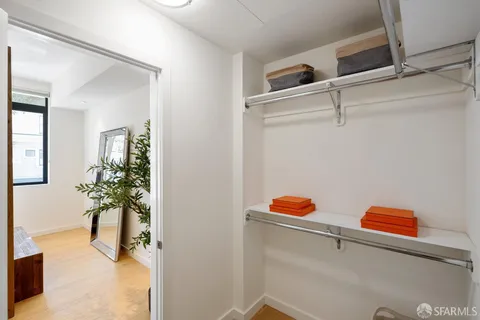 a white toilet sitting next to a shower