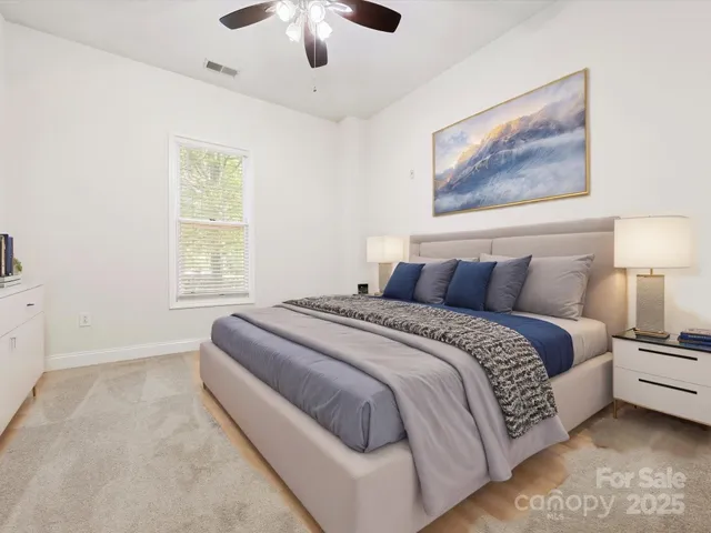 a bedroom with bed and window