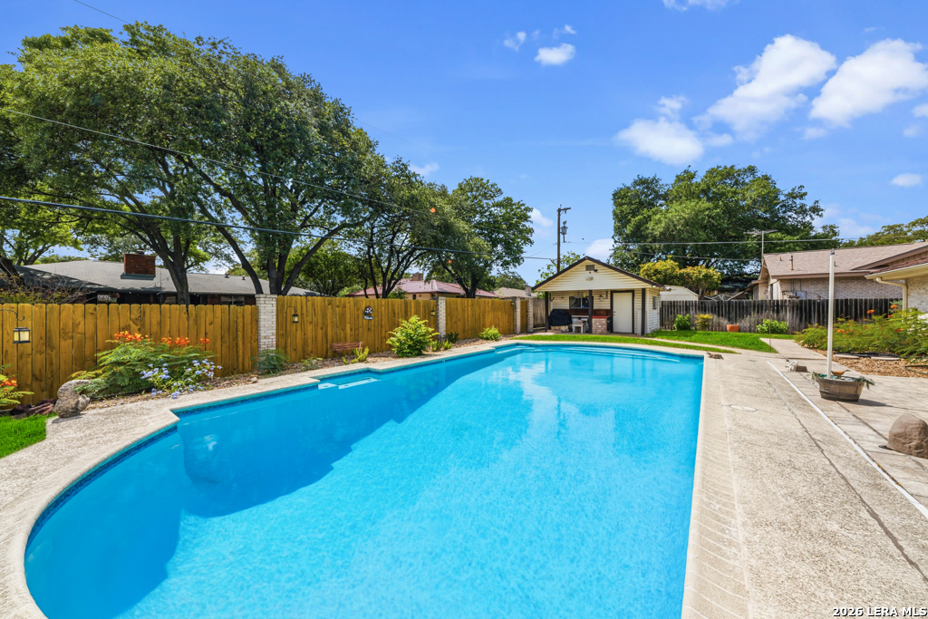 6022 Winding Ridge Drive Windcrest, TX 78239 - Photo 31 of 31 a view of a swimming pool with a patio and a yard