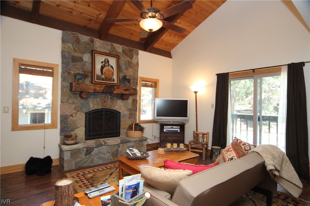 1025 Tomahawk Trail Incline Village, NV 89451 - Photo 2 of 8 a living room with furniture a fireplace and a flat screen tv