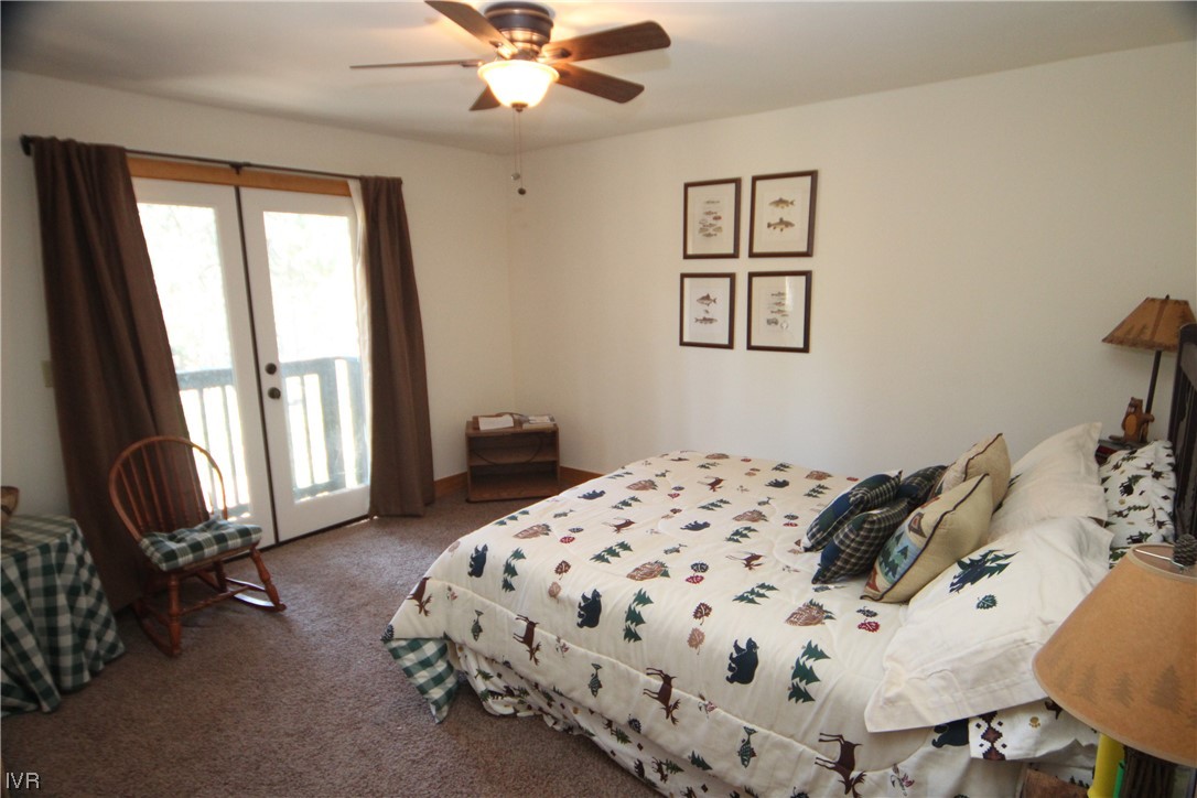 1025 Tomahawk Trail Incline Village, NV 89451 - Photo 4 of 8 a bedroom with a bed and a chandelier