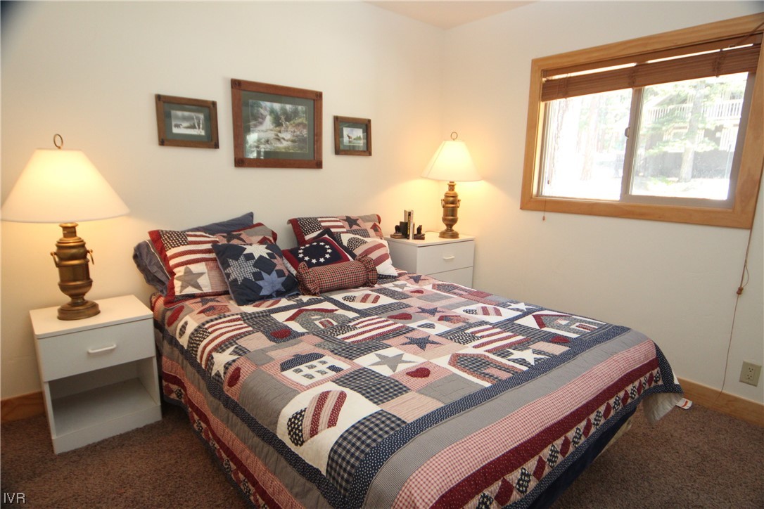 1025 Tomahawk Trail Incline Village, NV 89451 - Photo 6 of 8 a bedroom with a bed and a window