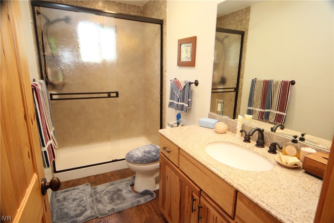 1025 Tomahawk Trail Incline Village, NV 89451 - Photo 7 of 8 a bathroom with a granite countertop sink toilet and shower