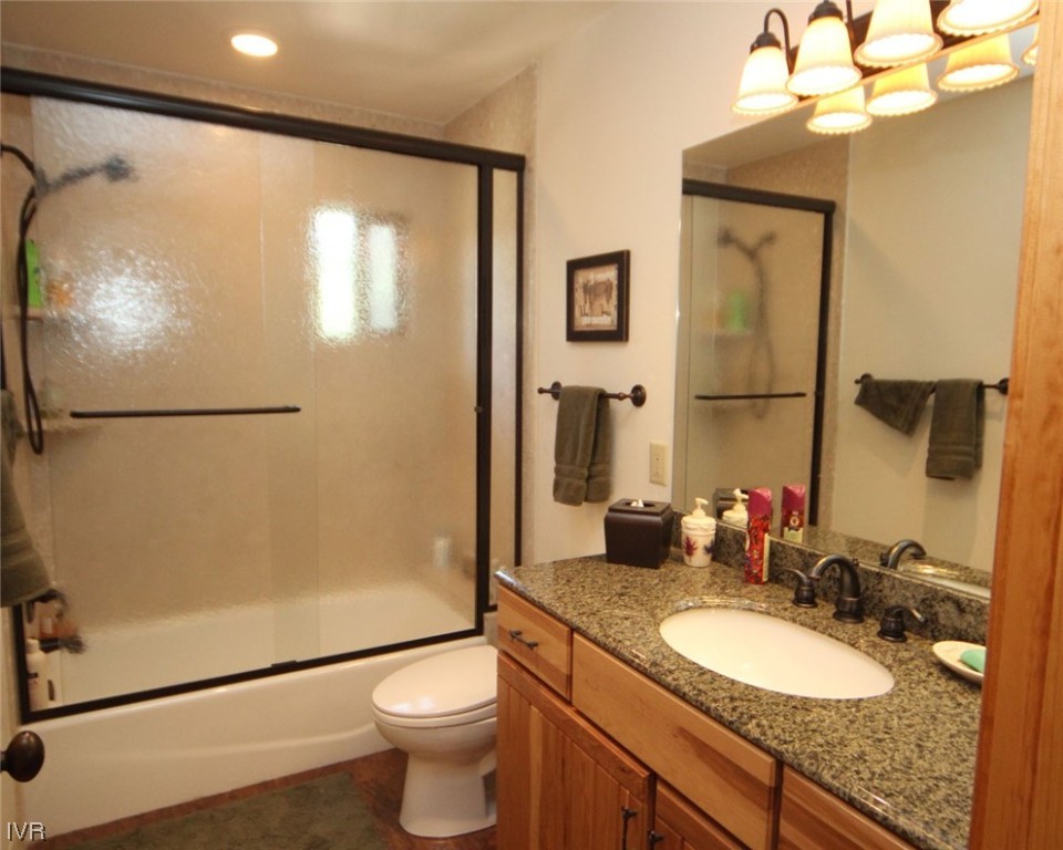 1025 Tomahawk Trail Incline Village, NV 89451 - Photo 8 of 8 a bathroom with a granite countertop sink toilet and shower