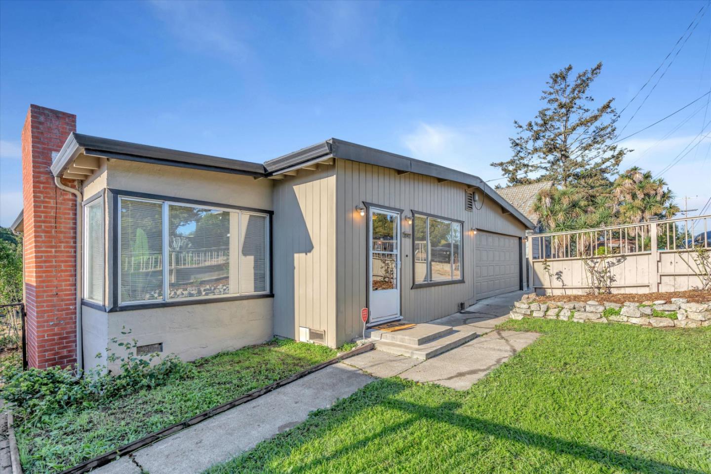 a front view of a house with a yard and porch