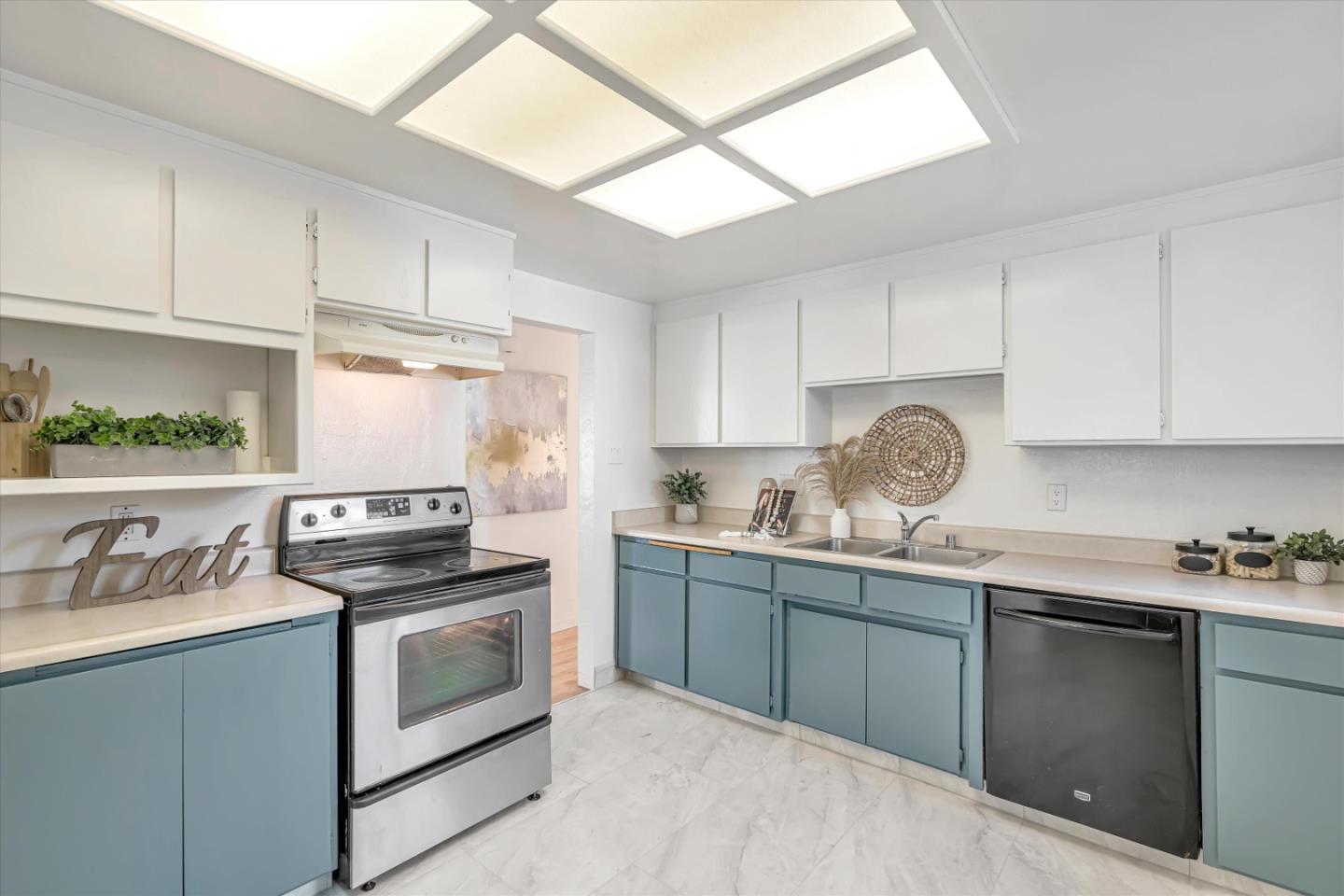 1041 Hargus Avenue Vallejo, CA 94591 - Photo 11 of 35 a kitchen with stainless steel appliances a sink a stove and cabinets