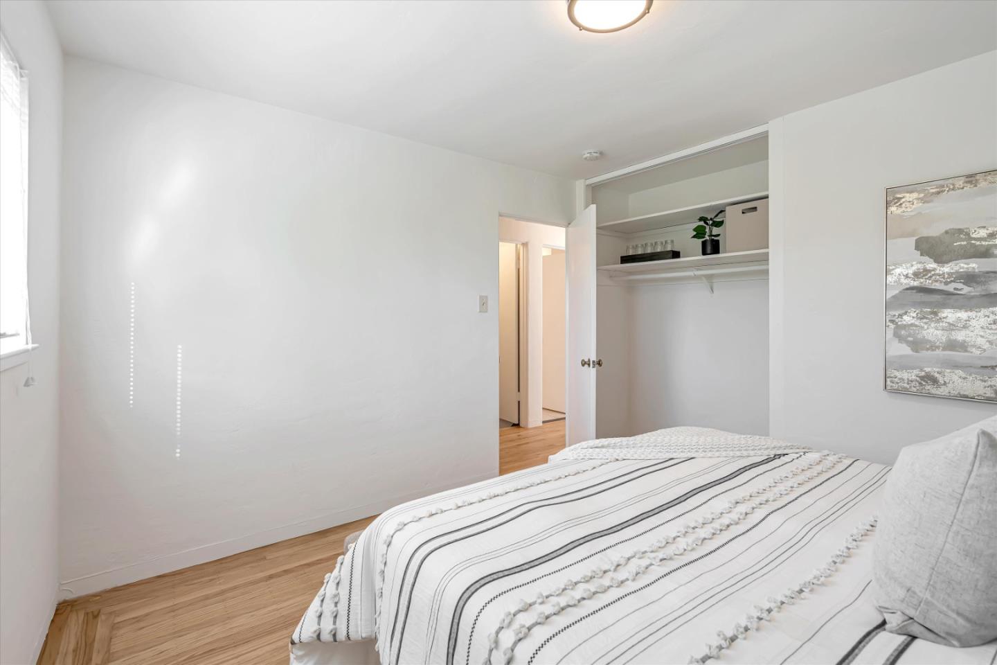 1041 Hargus Avenue Vallejo, CA 94591 - Photo 21 of 35 a bedroom with a bed and wall painting