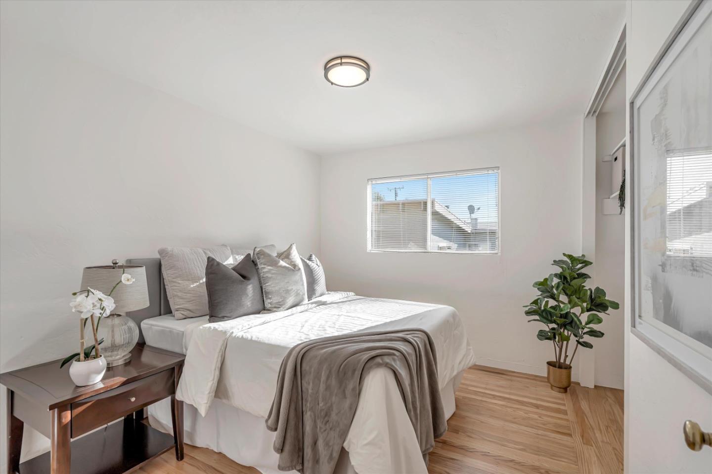 1041 Hargus Avenue Vallejo, CA 94591 - Photo 23 of 35 a bedroom with a bed and a potted plant