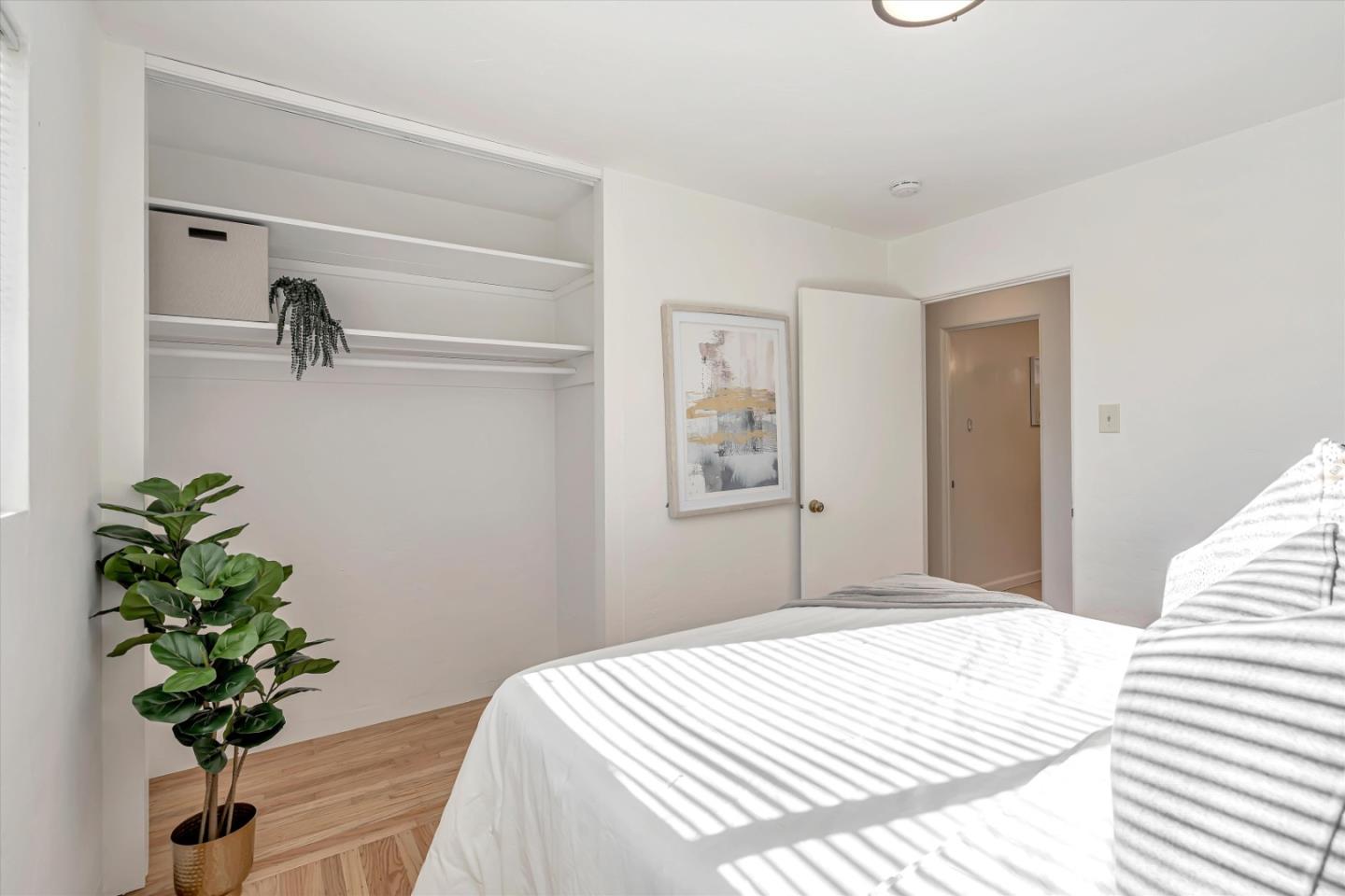 1041 Hargus Avenue Vallejo, CA 94591 - Photo 24 of 35 a bedroom with a bed and a potted plant