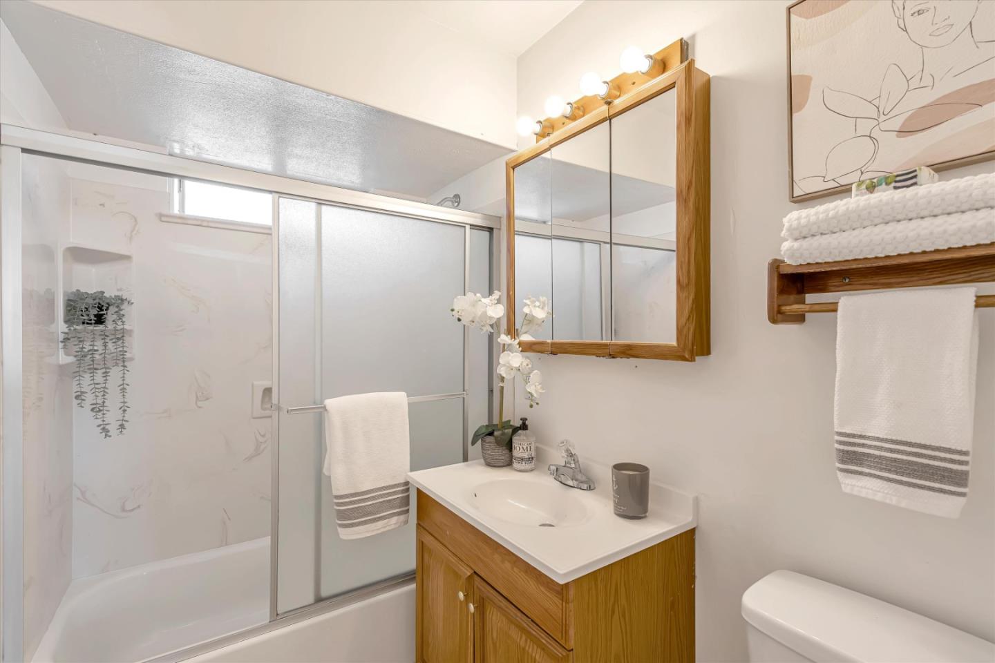 1041 Hargus Avenue Vallejo, CA 94591 - Photo 29 of 35 a bathroom with a sink toilet and shower