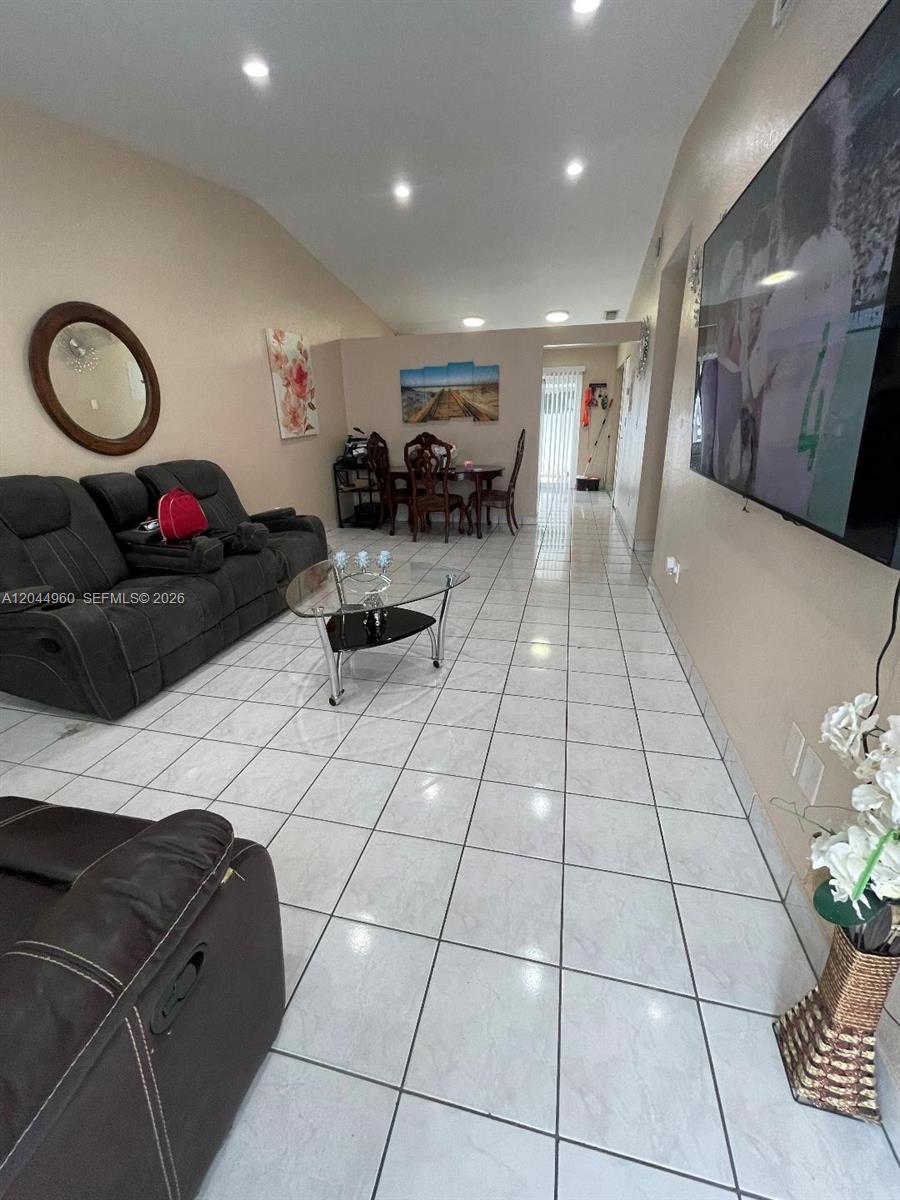 7681 Northwest 178th Terrace Hialeah, FL 33015 - Photo 4 of 11 a lobby with furniture and a potted plant