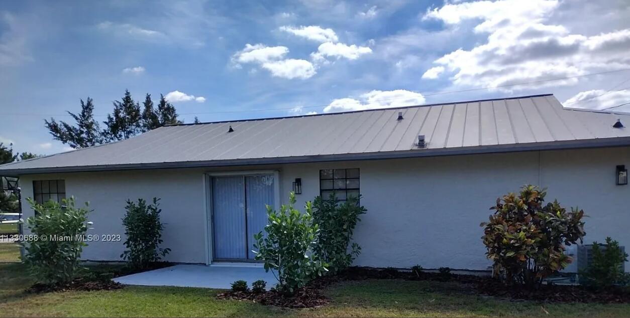 841 Northwest Riverside Drive Port St. Lucie, FL 34983 - Photo 15 of 17 Back Patio