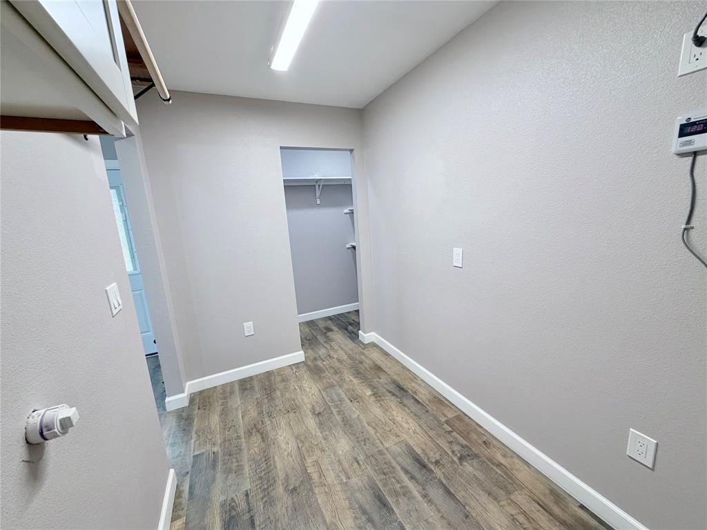 710 North Rusk Street Weatherford, TX 76086 - Photo 16 of 30 utility room with entry to pantry