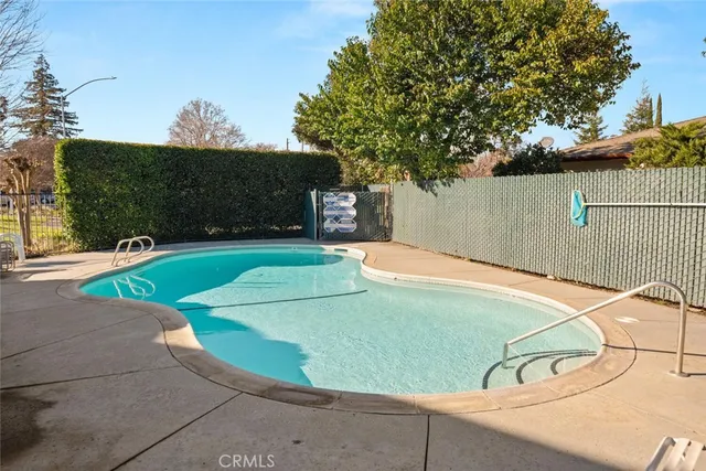 a couple of cars parked in front of a house