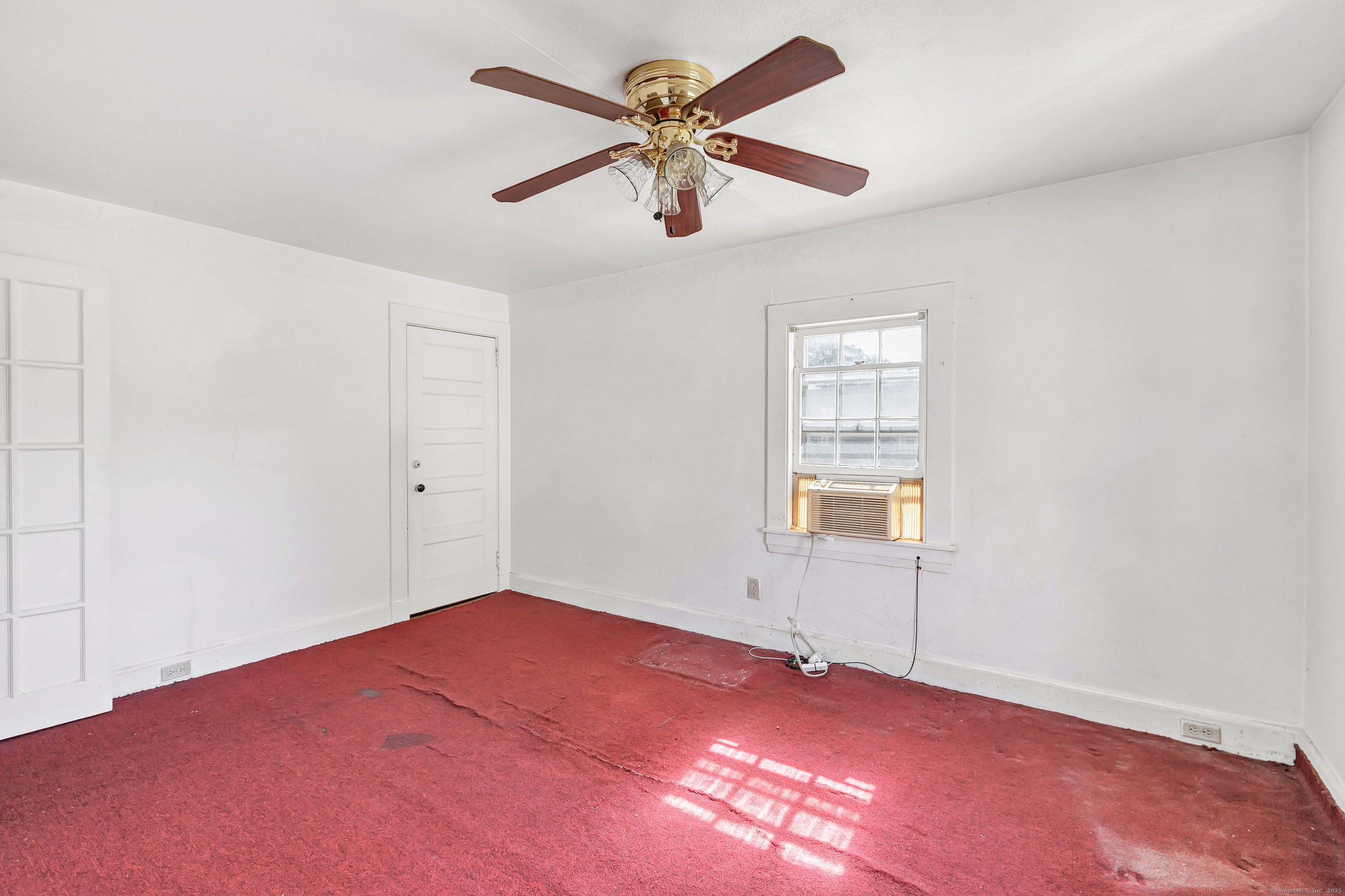 22 Sims Street Bridgeport, CT 06604 - Photo 20 of 22 an empty room with fan and windows