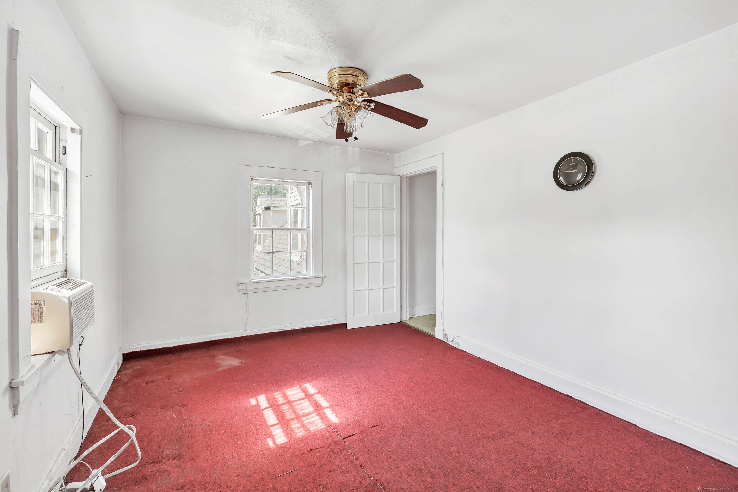22 Sims Street Bridgeport, CT 06604 - Photo 22 of 22 a view of empty room with window and ceiling fan