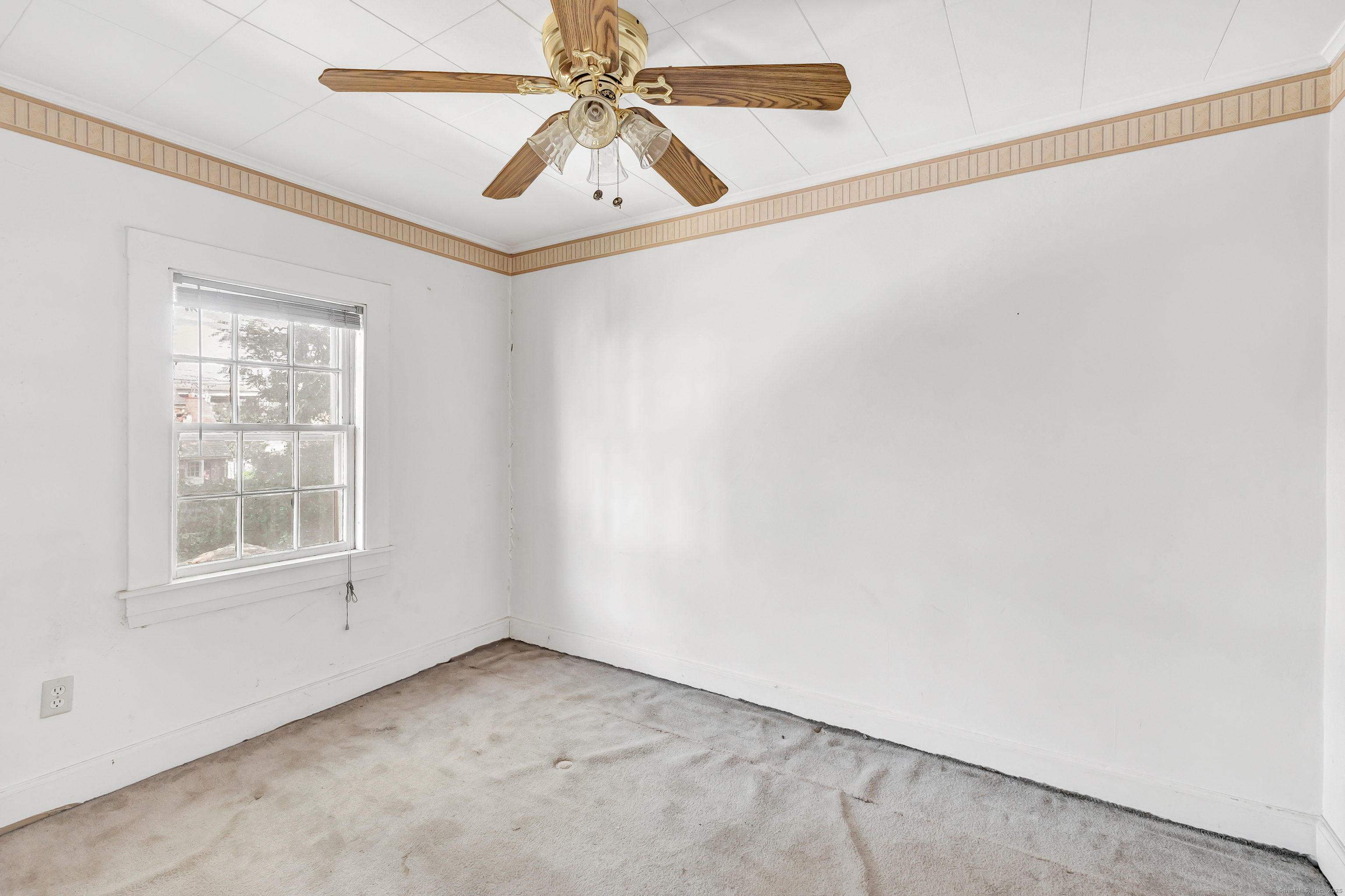 22 Sims Street Bridgeport, CT 06604 - Photo 8 of 22 an empty room with windows and fan