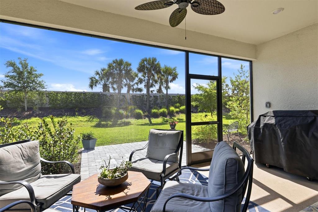 9268 Tequila Sunrise Drive Sarasota, FL 34241 - Photo 32 of 56 a view of a chairs and table in patio