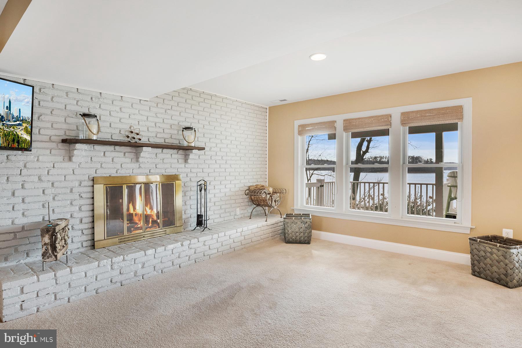 265 Long Point Road Crownsville, MD 21032 - Photo 24 of 37 A wood-burning fireplace has a brick surround