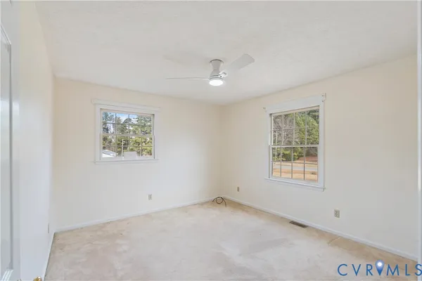 an empty room with windows