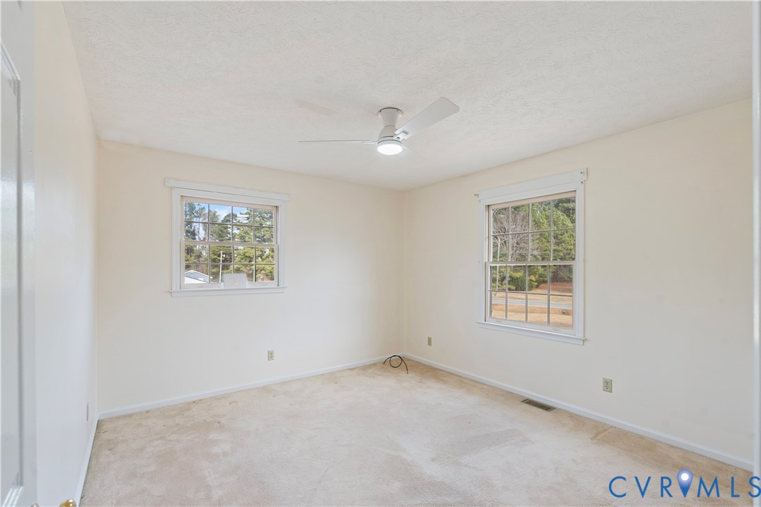 927 East Courthouse Road Blackstone, VA 23824 - Photo 11 of 23 2nd bedroom with carpet, a textured ceiling, a cei