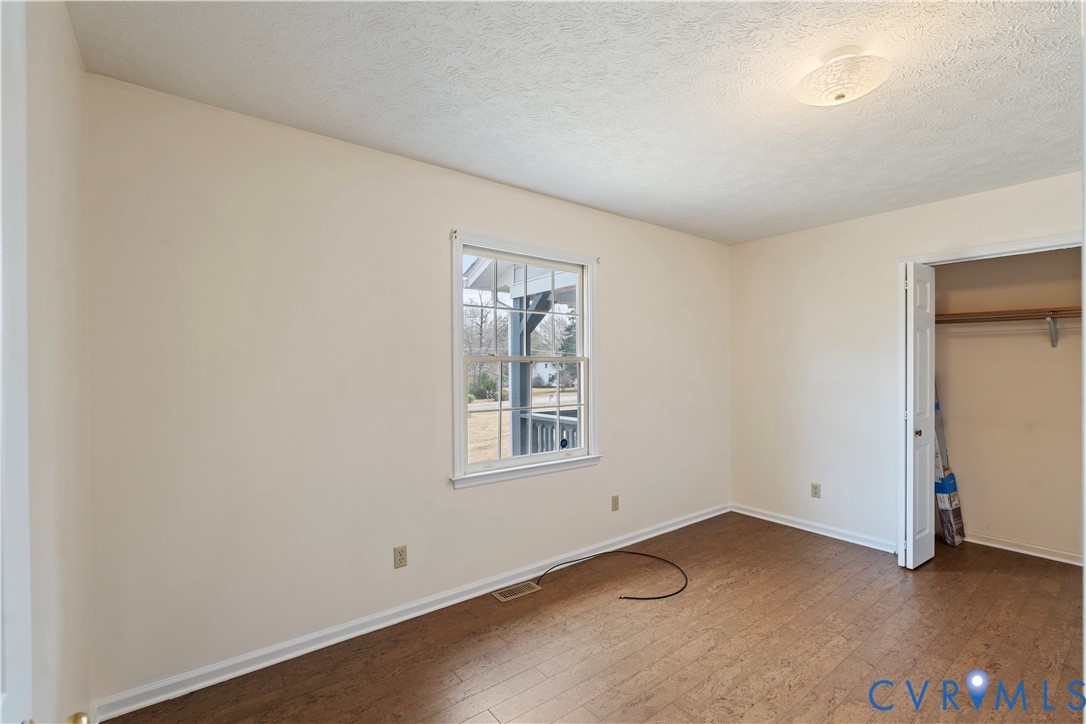 927 East Courthouse Road Blackstone, VA 23824 - Photo 12 of 23 Unfurnished bedroom featuring a textured ceiling,