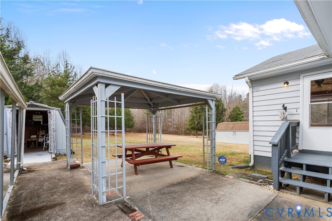 927 East Courthouse Road Blackstone, VA 23824 - Photo 19 of 23 View of patio / terrace featuring an outbuilding