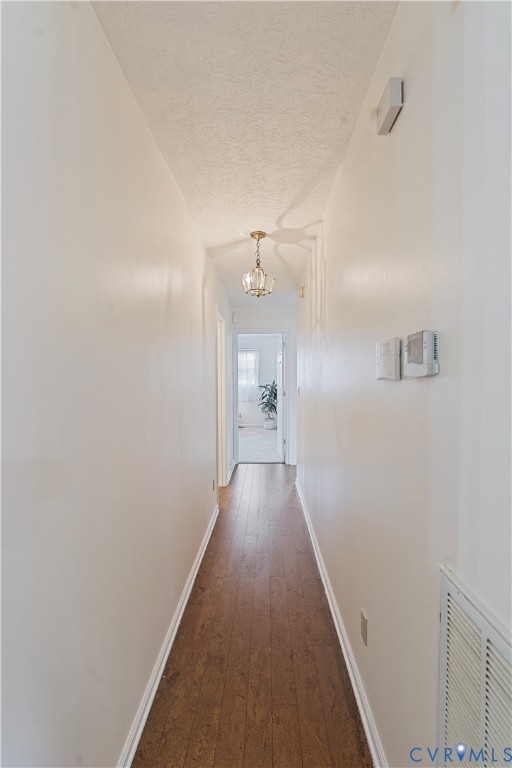 927 East Courthouse Road Blackstone, VA 23824 - Photo 9 of 23 Hallway featuring dark wood-type flooring, a chand