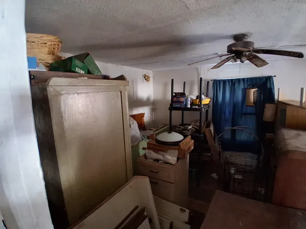 a bed room with bed and window