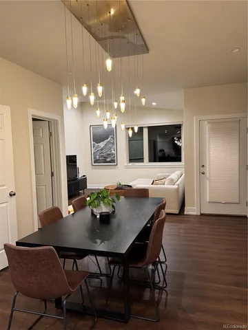 a kitchen with a table and chairs in it
