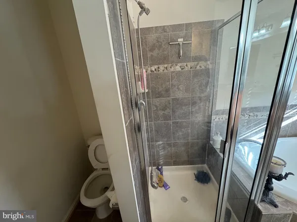 a bathroom with a sink double vanity granite and a mirror