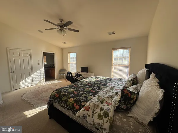 a view of a hallway with windows and couch