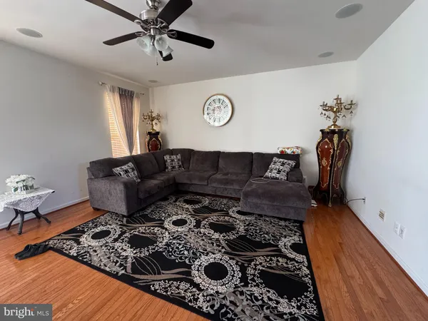 a living room with furniture and a rug