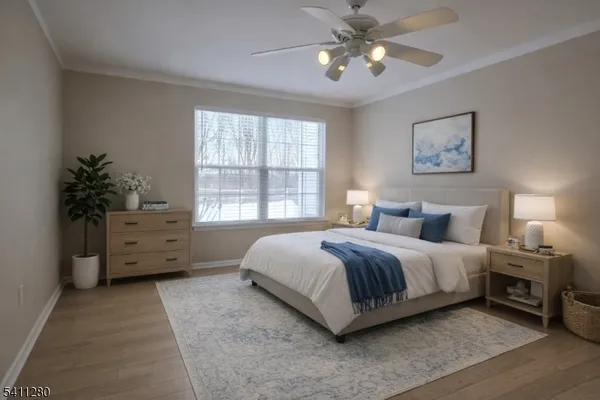 a spacious bedroom with a bed and a window