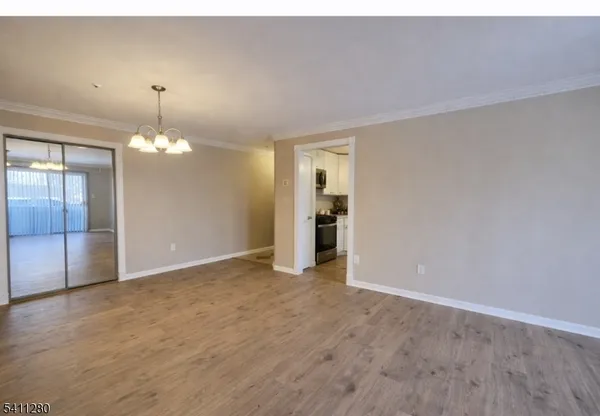 a view of an empty room with a fireplace