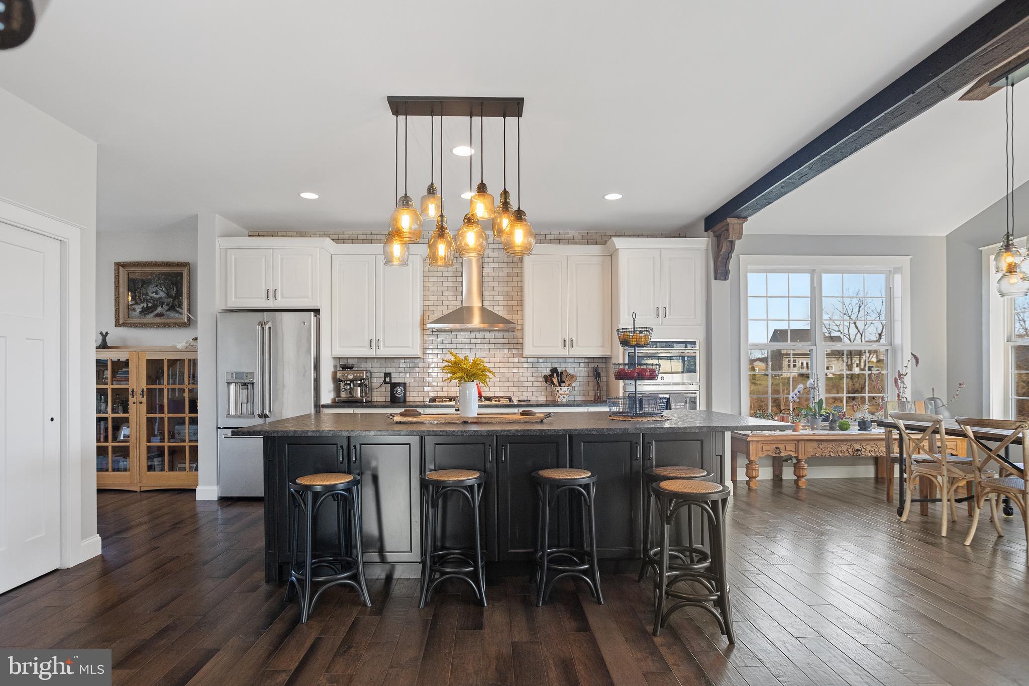 33 Docwill Drive Barto, PA 19504 - Photo 12 of 54 a kitchen with stainless steel appliances a dining table chairs and wooden floor